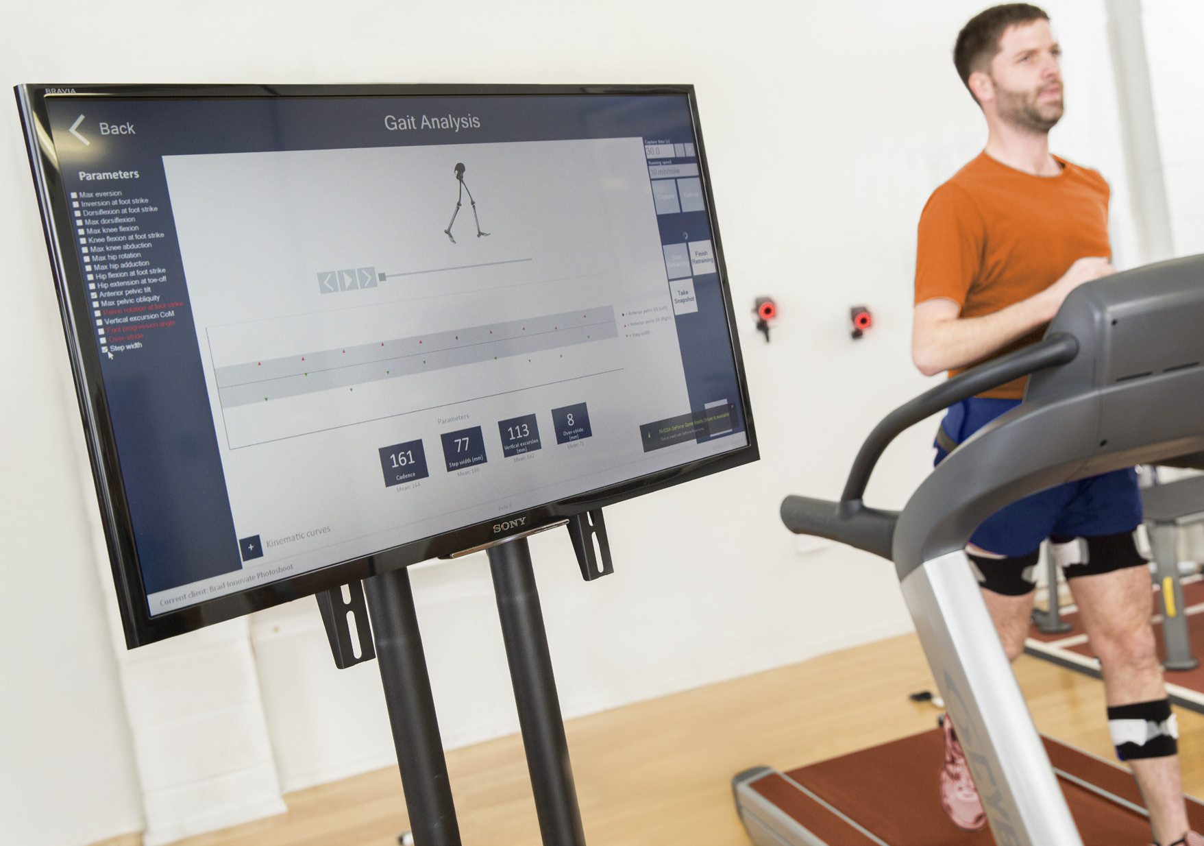 Run3D brochure demonstration showing a runner wearing reflective markers on a treadmill beside a movement-analysis screen
