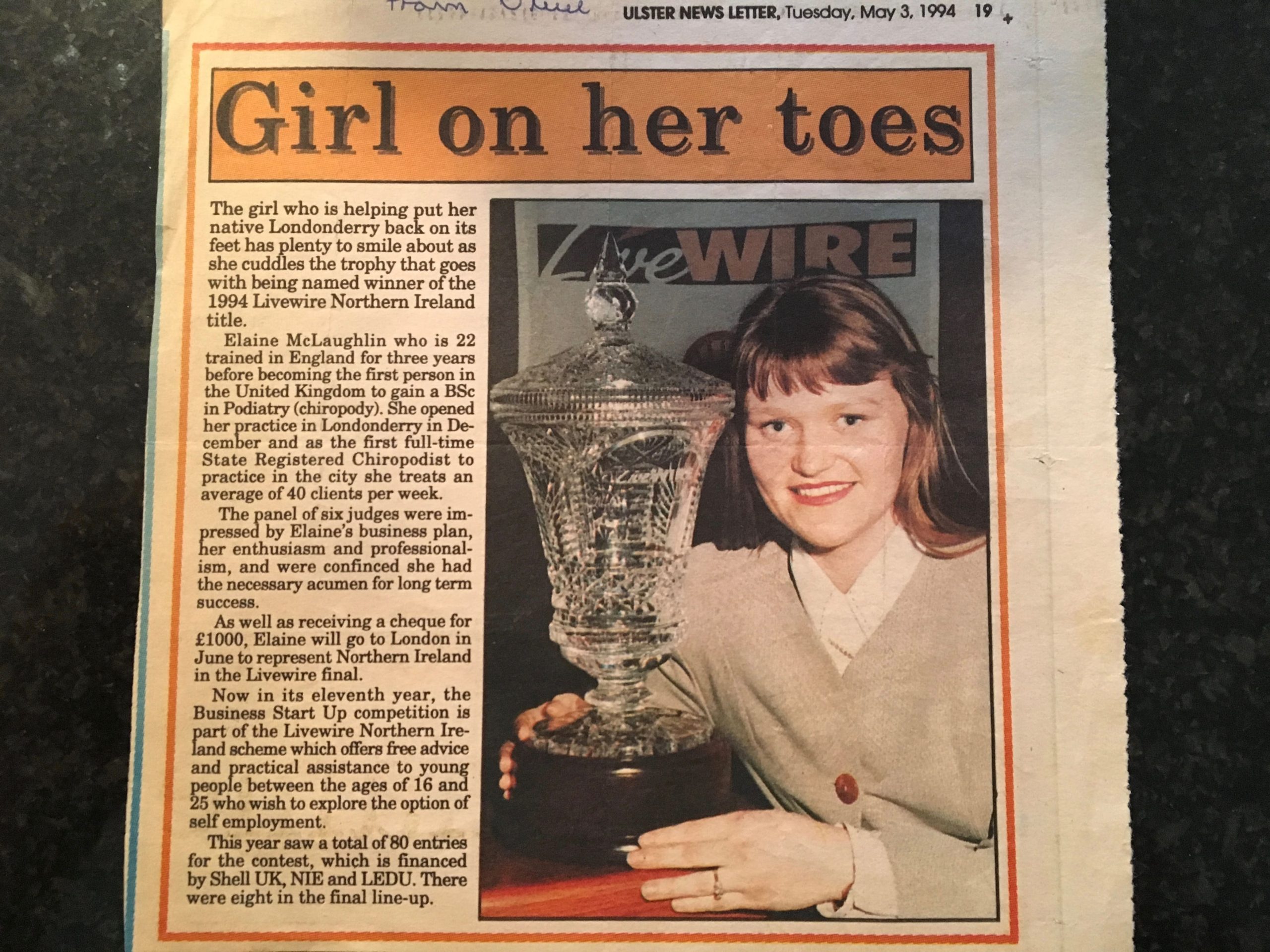 Elaine McLaughlin holding the Livewire trophy in newspaper coverage of her 1994 Northern Ireland title.
